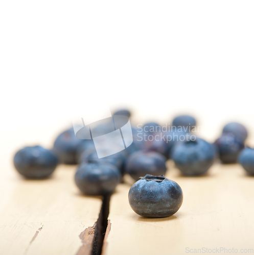 Image of fresh blueberry on white wood table