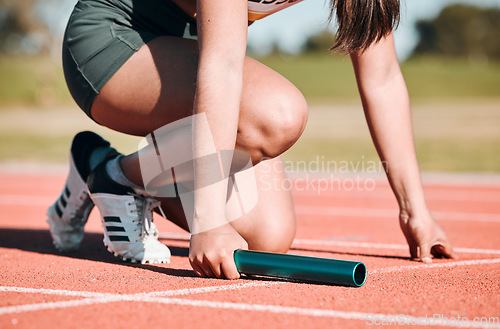 Image of Start, running and relay with hands of person on race track with baton for sports, competition and marathon. Exercise, health and wellness with closeup of runner in stadium for challenge and athlete