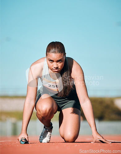 Image of Start, running and fitness with woman on race track with baton for sports, competition and marathon. Exercise, health and wellness with runner in stadium for challenge, speed and energy performance