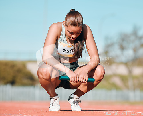 Image of Fitness, relax and woman athlete on track for a relay race, marathon or competition at a stadium. Sports, workout and young female runner resting with a baton for an outdoor cardio training exercise.