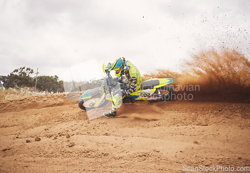 Image of Desert, dirt and motorbike cycling for sports, agile driving and off road adventure with speed, power and mockup space on cloudy sky. Motorcycle, rally challenge and driver in fast race on sand dunes