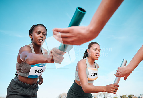 Image of Woman, teamwork and baton in relay, running competition or sports fitness on stadium track. Active people or athlete passing bar in competitive race, sprint or coordination for team performance