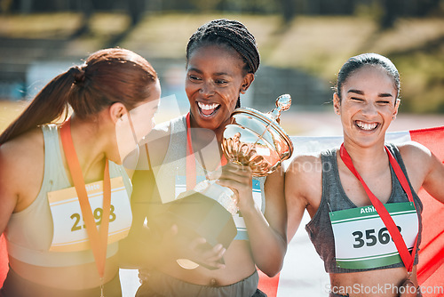 Image of Athletics winner, trophy and sports women celebrate prize victory, competition award or winning marathon challenge. Success, diversity champion or happy athlete group excited for teamwork achievement