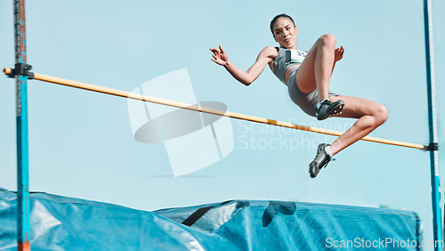 Image of High jump, woman and fitness with exercise, sport and athlete in a competition outdoor. Jumping, workout and training for performance with action, energy and contest with female person and athletics