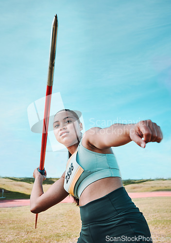 Image of Woman, javelin and olympic athlete in competition, practice or sports training in fitness on stadium field. Active female person or athletic competitor throwing spear, poll or stick in distance