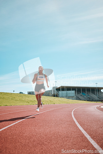 Image of Woman, athlete and running on stadium track in fitness, workout or cardio exercise for practice or training. Female person or runner in sports competition, performance or outdoor motivation on mockup