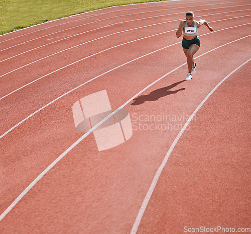 Image of Woman, athlete and running on stadium in fitness, workout or cardio exercise for practice or training on track. Female person or runner in sport competition, performance or race in outdoor motivation