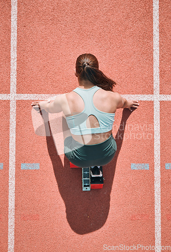 Image of Start, running and fitness with woman on race track from above for sports, competition and marathon. Exercise, health and wellness with runner in stadium for challenge, speed and energy performance