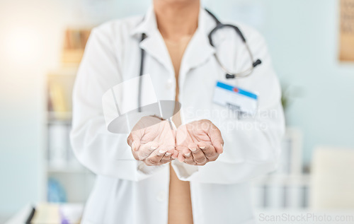 Image of Palm, healthcare and hands of a doctor for help, support or charity at a hospital. Closeup, work and a nurse or surgeon with a gesture for donation, prayer or faith at a clinic for medical trust