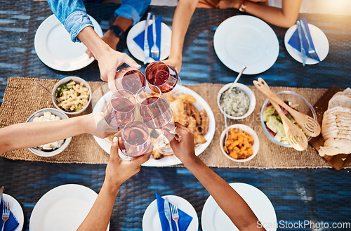 Image of Toast, food or top of friends in restaurant to relax on holiday vacation at a party event together. Cheers, group celebration or hands of fun people eating at table for lunch, dinner or brunch meal