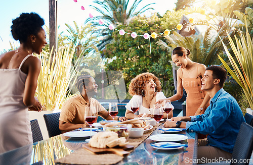 Image of Happy people, friends and food outdoor on a table for social gathering, happiness and holiday celebration. Diversity, men and women group eating lunch at party or event with wine to relax in garden