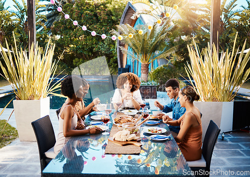 Image of Friends at lunch table in garden for happy event with diversity, food and wine bonding together. Outdoor dinner party, men and women at table, group of people eating with drinks in backyard in summer