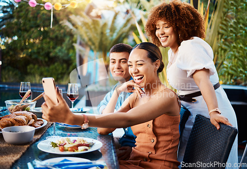 Image of Friends, food and selfie at outdoor table for holiday, Christmas or thanksgiving on social media. Young women, man or group with photography or influencer profile picture for happy brunch celebration