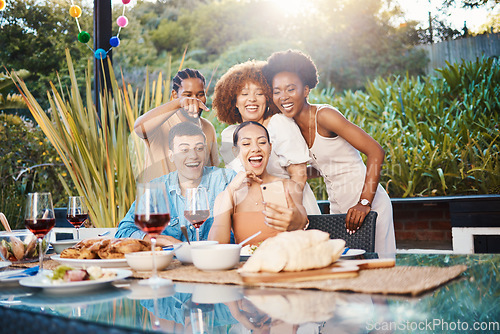 Image of Selfie, group of friends at dinner in garden and happy event with diversity, food and wine at outdoor party. Photography, men and women at table, fun people with drinks in backyard at sunset together