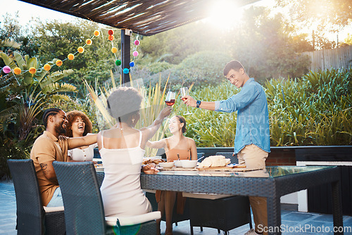 Image of Toast, friends at dinner in garden at party and celebration with diversity, food and wine at outdoor party. Glass cheers, men and women at table, fun people with sunset drinks in backyard together.