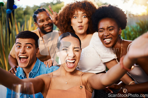 Image of Portrait, funny and selfie of friends at restaurant, bonding and happy memory together. Face smile, group and profile picture at cafe with wink, peace sign and tongue out for laughing on social media