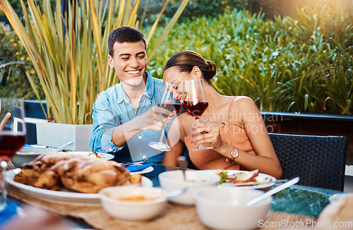 Image of Smile, couple and toast with wine glass at restaurant, bonding and having fun. Happy, alcohol and man and woman cheers at dinner party, celebration date and drink together at outdoor table with food