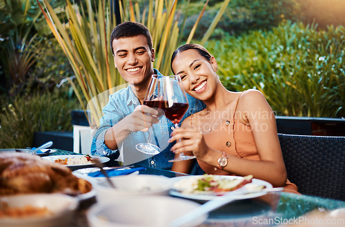 Image of Portrait, happy couple and toast with wine glass at restaurant, bonding and having fun. Face, alcohol and man and woman cheers at dinner party, celebration date and drink together at outdoor table