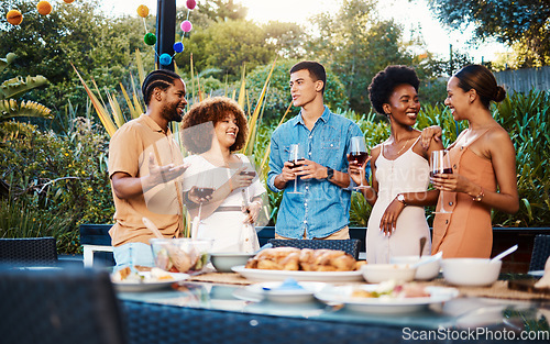 Image of Talk, friends at dinner in garden at party and celebration with diversity, food and wine at outdoor event. Conversation, men and women at table for lunch, fun people with drinks in backyard together.