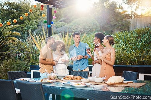 Image of Smile, diversity and friends at lunch in a garden with drinks, conversation and talking at a party. Happy, alcohol and group of men and women at an outdoor backyard dinner with communication