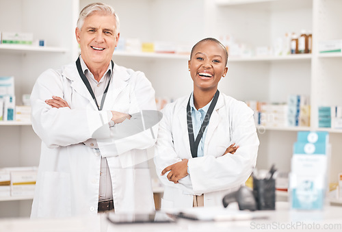 Image of Portrait, smile and arms crossed for pharmacy with a team in a drugstore for healthcare or treatment. Medical, collaboration or teamwork with a man and woman pharmacist happy a dispensary together