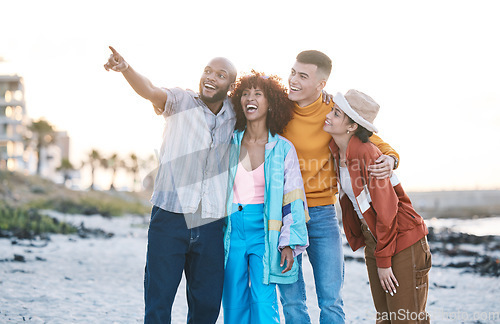 Image of Beach, friends and people with view, gen z and fashion with smile, pointing and travel with hug outdoor. Happy in nature, ocean and urban streetwear style, adventure and friendship with students