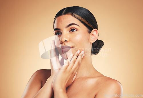 Image of Thinking, skincare and woman with natural beauty, dermatology and wellness on brown studio background. Person, idea and model with luxury, treatment and healthy skin with makeup, hygiene or aesthetic