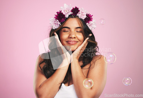 Image of Beauty, relax and bubbles with woman and flower crown in studio for cosmetics, skincare and wellness. Hair care, spa treatment and face with person on pink background for spring, glow and makeup