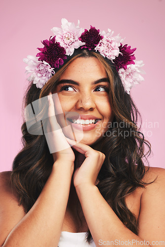 Image of Woman, flowers and crown for thinking of beauty in studio with natural skincare, spring plants and pink background. Face, model and floral wreath for sustainable cosmetics, dermatology and hair care