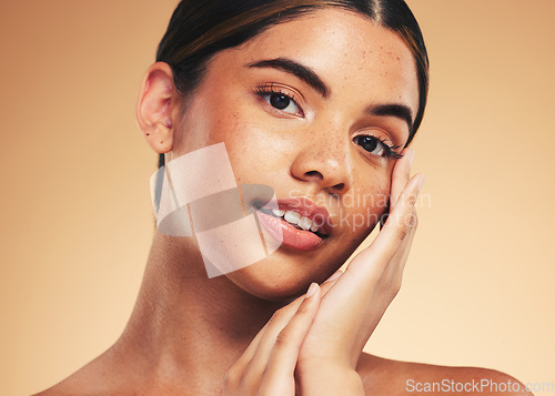 Image of Skincare, beauty and portrait of woman with hands for wellness, health and facial care in studio. Dermatology, spa and person on brown background in cosmetics, natural face and touch for satisfaction