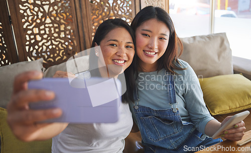 Image of Selfie, love and a lesbian couple in a restaurant for a romantic date together on their anniversary. LGBT, smile and happy asian woman with her partner in a cafe for celebration of a milestone event