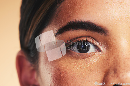 Image of Woman, eye macro and beauty in studio portrait with beauty, cosmetics or natural glow on face by background. Girl, model and facial zoom with change, melasma or skin for microblading, shine and clean
