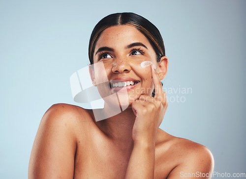 Image of Face, cosmetics cream and portrait of woman with aesthetic shine, dermatology and skincare makeup on studio background. Happy model thinking of facial sunscreen lotion for self care, beauty and glow