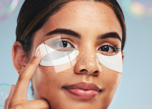 Image of Eye patch, portrait and face of woman for beauty, dermatology and aesthetic skincare on studio background with bubbles. Model, self care and cosmetics for eyes, facial collagen and anti aging product