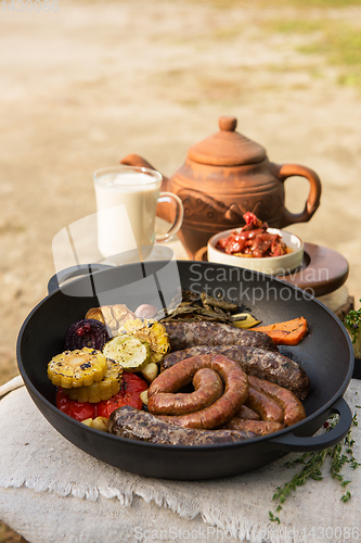 Image of Grilled sausages with vegetables