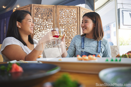 Image of Japanese women, restaurant and toast with sushi, smile and congratulations with fine dining, party or thinking. Asian friends, happy and success with fish, alcohol or relax in diner, wine and thanks