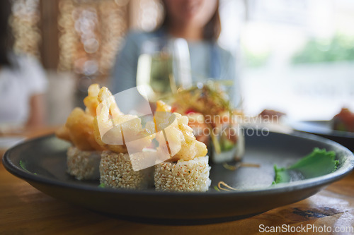 Image of Asian, sushi and food at a restaurant for dinner or lunch meal at a healthy Japanese cafe on table. Plate, cuisine and luxury fine dining takeaway or seafood from a Salmon menu for diet or nutrition