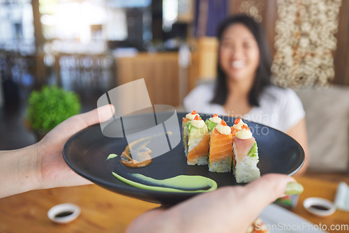 Image of Sushi restaurant, people and waiter hands serving food plate, order or fish product for diner, cafeteria or shop customer. Startup small business, server and closeup person with lunch meal for client