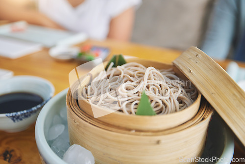 Image of Restaurant, bamboo and closeup of a bowl of noodles for authentic Asian cuisine for diet. Food, steamer pot and zoom of Japanese ramen for a nutrition meal for dinner, lunch or supper at a diner.