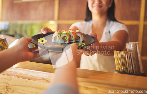 Image of Sushi, restaurant worker and woman hands with smile from food and Asian meal in kitchen. Happy, female waiter or chef working with salmon roll lunch order with cooking in Japanese bar with service