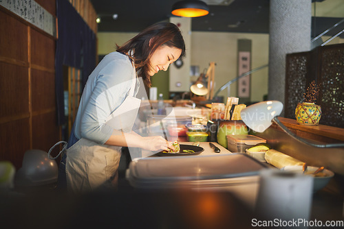 Image of Sushi chef, restaurant and prepare in kitchen with start, service or plate on table, job or catering. Small business, fast food and cooking in cafe, startup diner and smile with fish, rice or seaweed