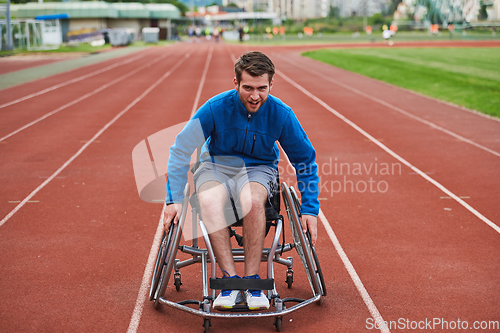 Image of A person with disability in a wheelchair training tirelessly on the track in preparation for the Paralympic Games