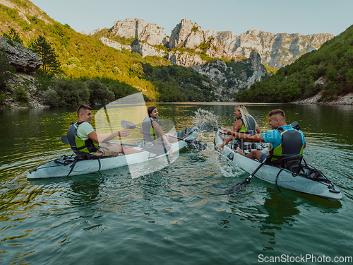 Image of A group of friends enjoying having fun and kayaking while exploring the calm river, surrounding forest and large natural river canyons