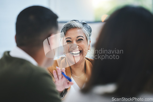 Image of Team, happy woman or business people in meeting laughing at funny joke in discussion or collaboration together. Smile, leadership or excited mature mentor talking or speaking of ideas to employees