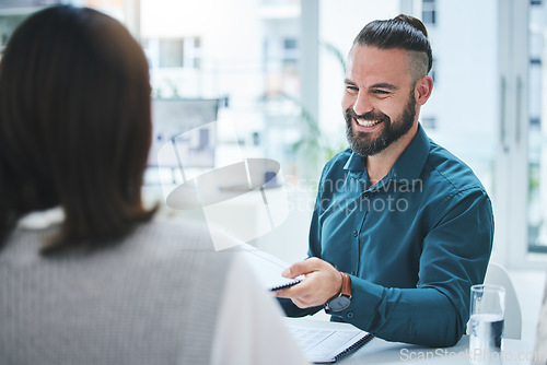 Image of Teamwork, meeting and documents with a business man in the office for planning or strategy. Collaboration, smile and portfolio with a team in the boardroom for contract agreement or discussion