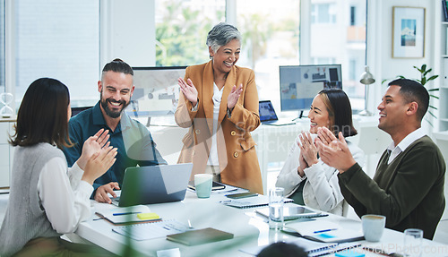 Image of Happy business people in meeting at desk with applause, cheers and celebration of sales target achievement. Clapping, praise and congratulations with success, motivation for men and women in office.