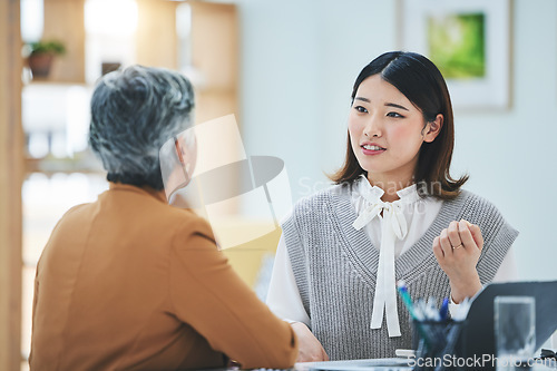 Image of Meeting, discussion and business women in office for brainstorming, ideas and collaboration. Corporate feedback, teamwork and worker talking to manager working on project, proposal and strategy