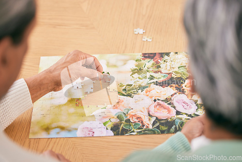 Image of Puzzle on table, entertainment and senior couple in home for bonding, fun activity and relax together. Retirement, marriage and above of man and woman with jigsaw for playing games, hobby and connect