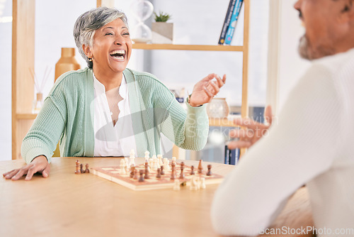 Image of Laughing, game and senior couple with chess in a house in retirement for a competition. Happy, together and a funny and elderly man and woman with a board for a challenge or bonding with conversation