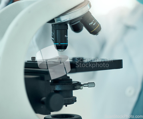 Image of Microscope, science and laboratory with closeup and analysis, pathology and investigation with medical research. Knowledge, health study and pharmaceutical with biology, biotechnology and equipment